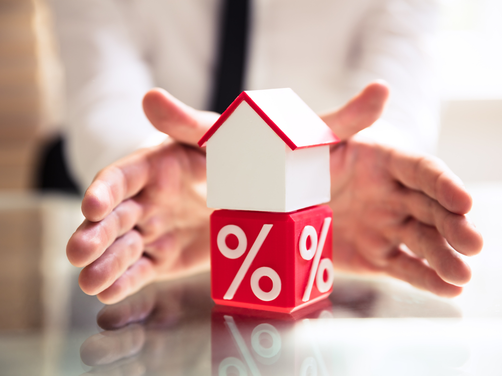 A house over a percentage symbol